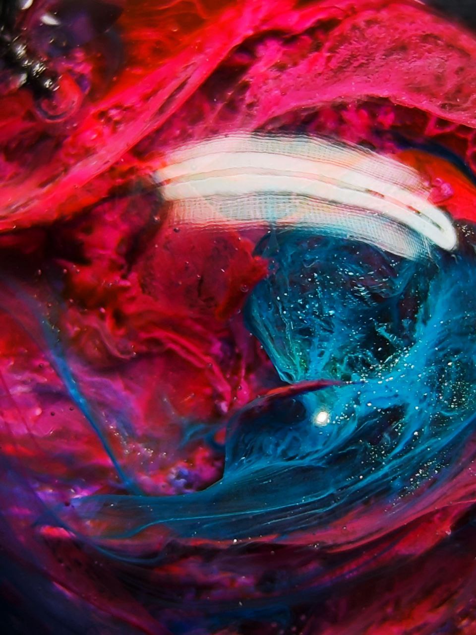 Magic jewelry space hearts made of epoxy resin and alcohol ink.