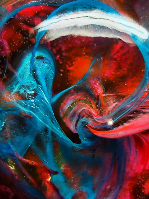 Magic jewelry space hearts made of epoxy resin and alcohol ink.