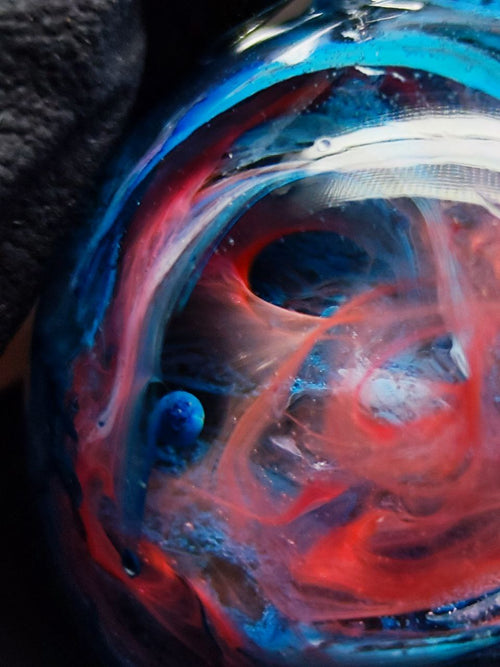 Magic jewelry space hearts made of epoxy resin and alcohol ink.