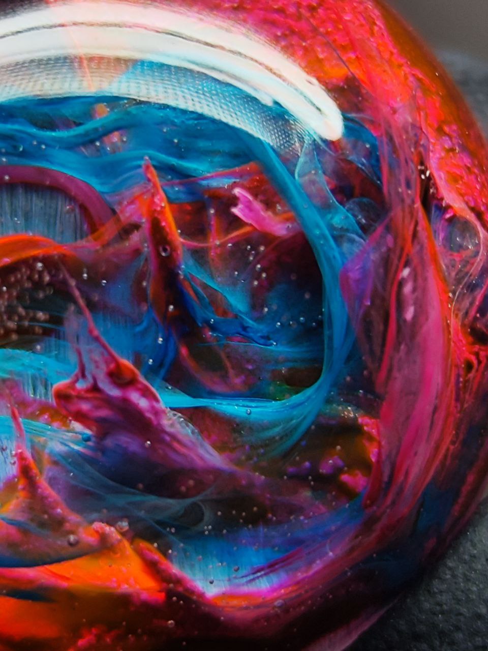 Magic jewelry space hearts made of epoxy resin and alcohol ink.